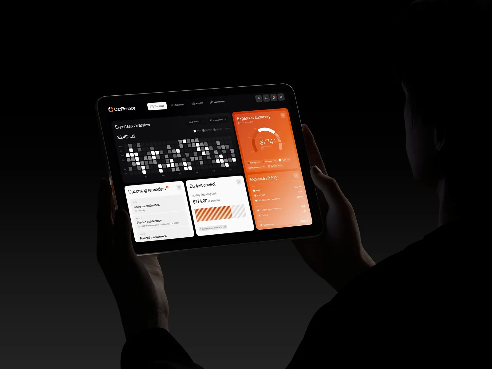 Car finance platform on a tablet showing expense history, budget controls and upcoming reminders